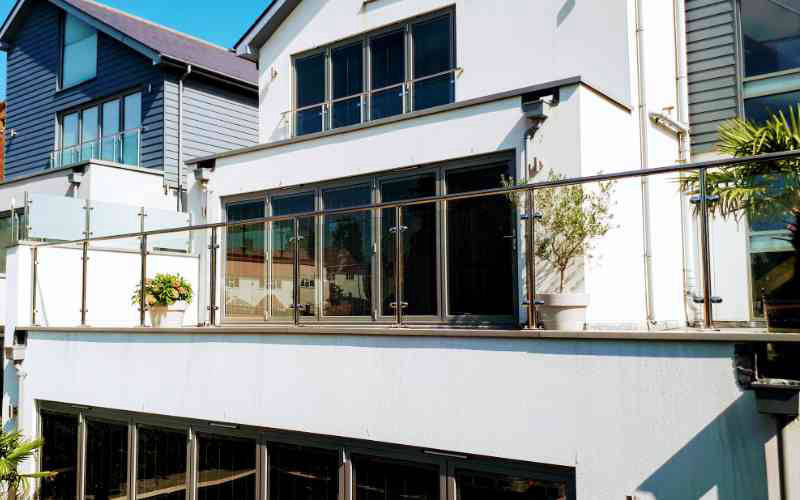 Stainless steel railings with glass and top rail